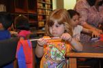 AMY MILLER/TIMES NEWS Ellie Wilds inspects the streamer that she made during a recent day camp at Penn-Kidder Elementary School in Jim Thorpe.