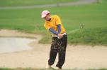 Marian's Josh Green blasts out of a sandtrap during the District 11 Class AA team championships on Wednesday at the Willowbrook Golf Course.