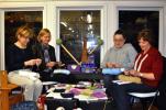 DONALD R. SERFASS/TIMES NEWS Tamaqua area volunteer knitters seen here Tuesday night have been spending hours producing Memory Squares from skeins of yarn. The squares will be assembled into quilts for victims of the Sandy Hook shooting. From left…