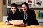 AP Photo/Michael Dwyer Janell Burley Hofmann, right, holds a copy of the contract she drafted and that her son Gregory, left, signed as a condition for receiving his first Apple iPhone.