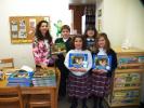 SPECIAL TO THE TIMES NEWS Author and photographer Kathy Miller poses with her "Chippy Chipmunk" books and several OLOAA students: Jacob Trubilla, Julia Jurick, Sara Collevechio and Allison Slakoper.