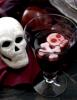 This photo shows a "goblet grave" with yogurt frozen into the shape of a skull and crossbones floating in a glass of grape juice in Concord, N.H. (AP Photo/Matthew Mead)