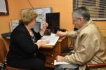 AMY MILLER/TIMES NEWS Marilyn Rontz of Jim Thorpe, right, goes through the medications she is currently taking with Susan Zeigler, care management supervisor for the Carbon County Area Agency on Aging, during a recent Medicare open enrollment help…