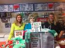 SPECIAL TO THE TIMES NEWS Mary Ann Dulaney, left; Ruth Weiss, owner of Tommy's Italian Restaurant, Coaldale; and Jess Kutza, with the Socks for Seniors boxes. Items can be dropped off at numerous businesses in Carbon and Schuylkill counties.