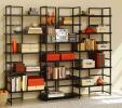 AP Photo This photo provided by AllModern.com shows a TFG Connections Bookcase, an open-backed modern bookcase that can be used to divide rooms or set the perimeter of a library-focused space. Contemporary home libraries utilize room for books or…
