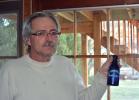 DONALD R. SERFASS/TIMES NEWS John Paul "Bussy" Jones, New Ringgold, began digging farm dumps and outhouses in 1980 and never stopped, amassing a collection of rare old bottles.