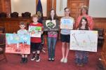 AMY MILLER/TIMES NEWS First-place winners of the 39th annual Carbon County Conservation District Poster Contest showcase their posters on Wednesday evening. Winners are, from left, Andrew Dotzel of Weatherly Elementary, kindergarten and first grade…