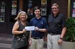 Helen Van Pelt, president of the Mauch Chunk Historical Society, and Bob Stevenson, vice president of the Mauch Chunk Museum and Cultural Center, present a $500 scholarship to Bronson Ford.