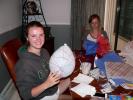 This Thursday, July 3, 2014 photo shows Hope Clarke, 16, left, as she wraps yarn soaked in craft glue around a balloon while Hadley Hagemann, 16, works on a giant tissue pom-pom at a crafting night hosted at Clarke's house in Arvada, Colo. After the…