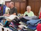 Luther Snyder and Miriam Borosh laugh as they go through donated clothing at St. Johns Lutheran church in the heights section of Jim Thorpe.
