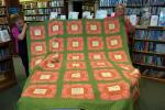 LINDA KOEHLER/TIMES NEWS Left, The Sew What Quilt Guild members Brenda Wentz and right, Terri Sheckler (president), display the 1868 antique quilt which will be featured at the 8th Annual Quilt Show at the Palmerton Area Library, Sunday, Oct. 12.