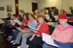 KAREN CIMMS/TIMES NEWS Members of the Bach and Handel Chorale rehearse Monday at St. John's in the heights  section of Jim Thorpe, its home base. The chorale is preparing for a series of Christmas concerts that begin this weekend. For a video of the…