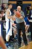 Bob Ford/Times News Longtime basketball referee Jim Strubinger hands the ball to Tamaqua's Ben Miller during a recent game.
