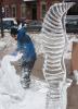 Neil Trimper of Sandystone, New Jersey, an employee of Sculpted Ice Works in Lakeville, Pennsylvania, carves a saxophone in front of the Opera House in Jim Thorpe. In the forground is an outstretched eagle he carved earlier. Trimper has demonstrated…