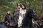 This photo released by Sony Pictures Television shows Caitriona Balfe as Claire Randall, right, and Sam Heughan as Jamie Fraser, center, and Grant O'Rourke as Rupert MacKenzie, in a scene from Starz' new TV series, "Outlander." (AP Photo/Sony…