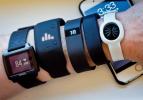 AP Photo/Bebeto Matthews, File Fitness trackers, from left, Basis Peak, Adidas Fit Smart, Fitbit Charge, Sony SmartBand, and Jawbone Move, are seen next to an iPhone. Sales of fitness trackers are climbing, and the biggest maker of the gadgets,…