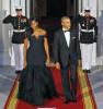 President Barack Obama, right, and first lady Michelle Obama wait for the arrival of Chinese President Xi Jinping and his wife Peng Liyuan at the White House Friday. AP PHOTO/STEVE HELBER