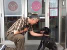 Longtime trainer and associate director of adoptions and resident care Mike Rueb, left, and Clay, a 9-month-old black lab mix, are shown outside the Bideawee pet center in New York. Bideawee is a 112-year-old no-kill shelter in Manhattan. No-kill…