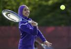 Tabarek Kadhim, a sophomore at Deering High School in Portland, Maine, wears a sports hijab while playing a tennis match in Windham, Maine. AP PHOTO Copyright - Copyright 2017 The Associated Press. All rights reserved.
