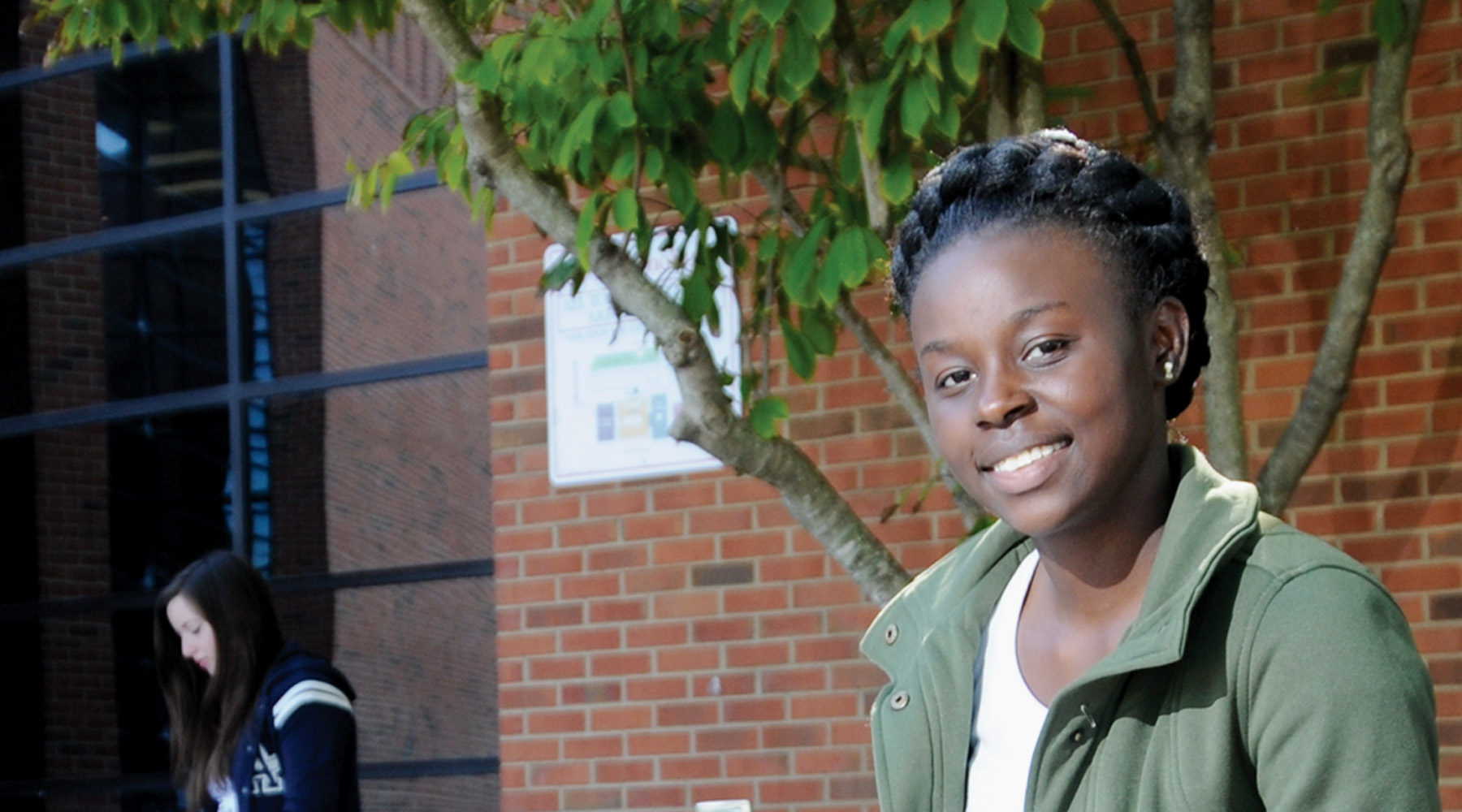 Tn Promise Student Outside Of K Building