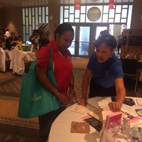 Christine providing self-breast cancer screening info