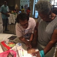 Janis provides hands-on self breast exam technique