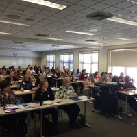 Crowded room ready to hear Jean Chung, MSN, CRNP present on ECMO