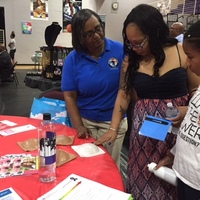 Romona teaches female participant Self-breast exam  Paine College Health Fair  26 Jun 18