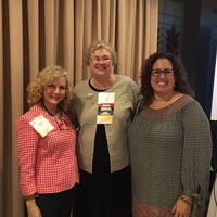 MNA Immediate Past President, Kathy Ogle,  poses with attendees after the opening session.