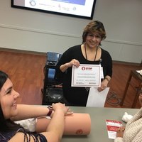 President-elect Norma Avitua presenting certificate of training.