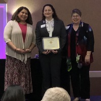 Valerie receiving award