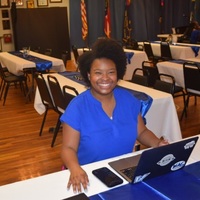 Sha’Quinte Golden prepares to welcome/check-in guests 