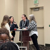 ACNA members and guests gathering and mingling. 