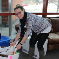 Jen Paquette donating to the food pantry.
