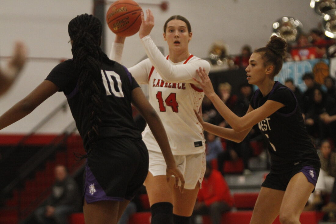Lawrence girls basketball starts season with win over Topeka West; boys move to 2-0 after beating KC East