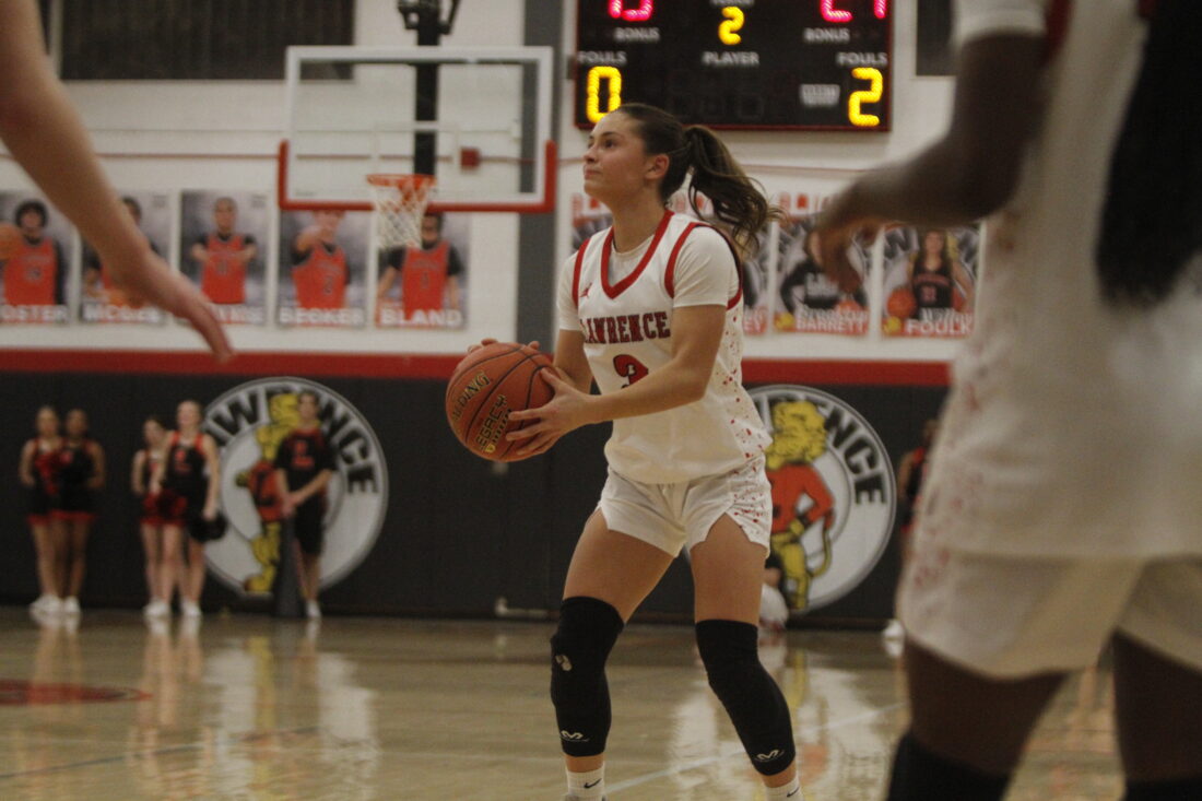 Lawrence boys and girls basketball teams suffer first loss of the season at home to Olathe South