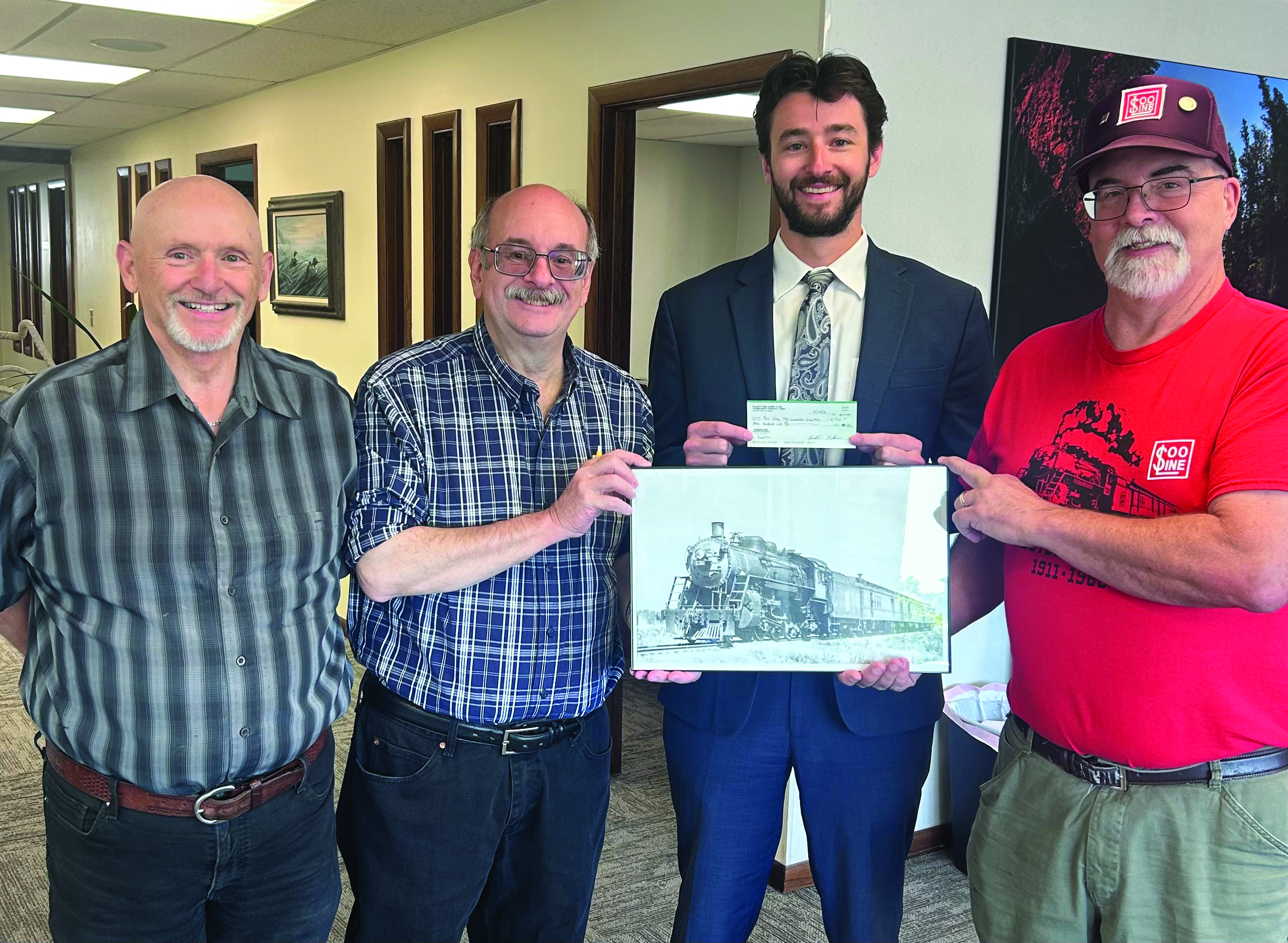 Gladstone Lions donate $500 to the Michigan Soo Line Steam Engine #730 Authority