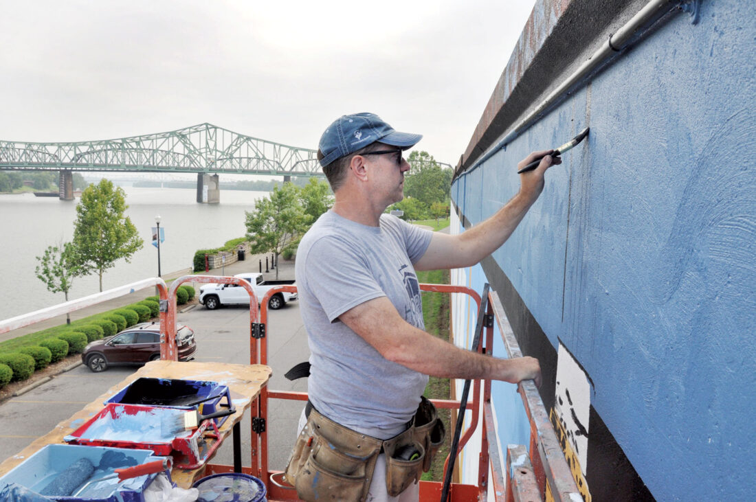 Training His Focus: Artist adds railroad scenes to Parkersburg Floodwall mural | News, Sports, Jobs - Vimarsana News
