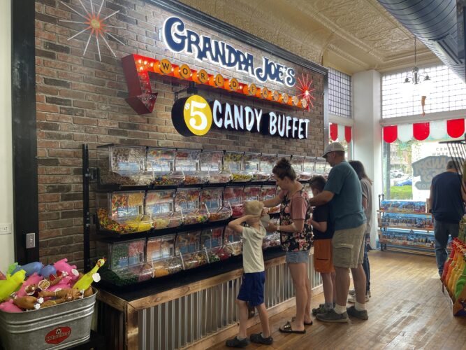 Eager Visitors Explore Selection at Grandpa Joe's Candy Shop in Wheeling's Centre Market | News, Sports, Jobs - Vimarsana News