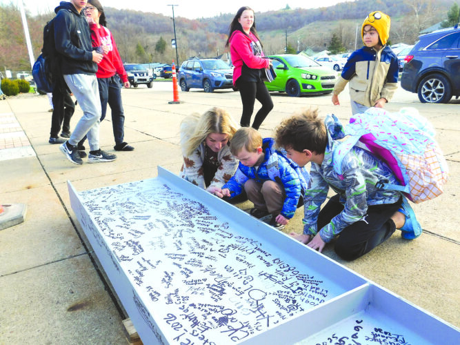 Bridgeport students, staff a part of school history with beam signing