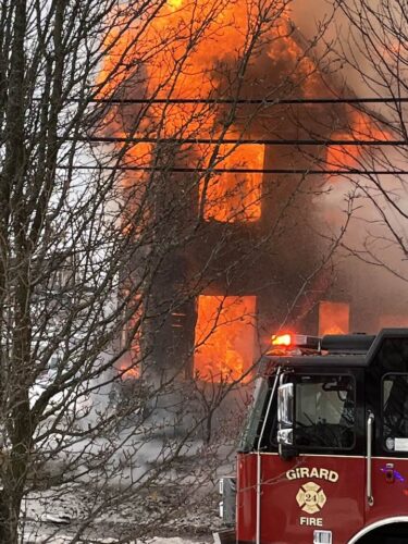 Firefighters battle Girard blaze