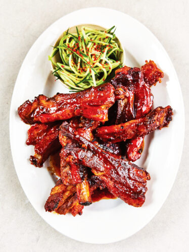 Slow-cooked, sticky-glazed pork ribs go with cucumber slaw