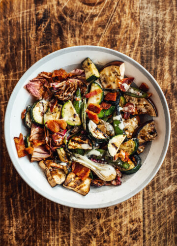 Grill vegetables and toss them in bacon vinaigrette