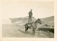 Man standing on horse