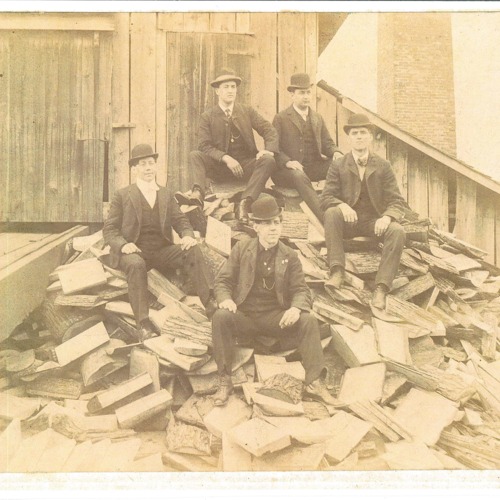 Old Mill photo men on wood pile.  Top left is Lawrence Heckel, top right is Frank Lescher, left middle is Alley Wilford, right middle is Joe Miller, bottom center is Charlie Wilford.