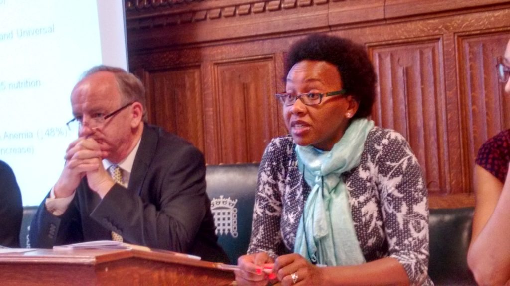 Esther Kariuki and MP Laurence Robertson at the "'What works for Nutrition? Stories of Success from Vietnam, Uganda, and Kenya" report launch.