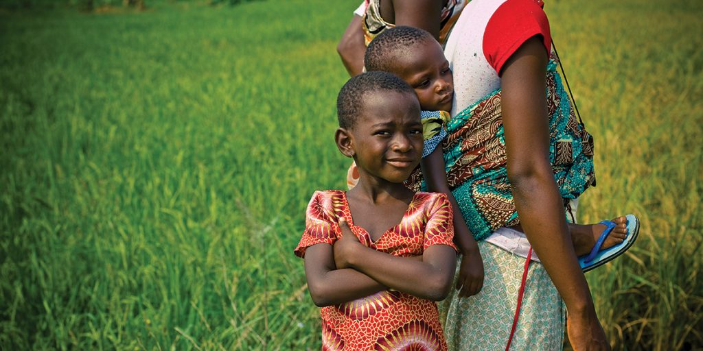 A family at the Okyereko Rice Cooperative Association in Ghana. (Photo credit: Morgana Wingard/ONE)