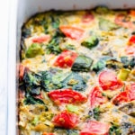 This whole30 breakfast casserole recipe is made with nothing but eggs and nutritious veggies like spinach, eggplant, avocado, broccoli and tomato. This healthy breakfast bake is the perfect easy dish for a family brunch. It is also vegetarian, paleo, low-carb, dairy-free and gluten-free. | onecleverchef.com #glutenfree #vegetarian #breakfast #cleaneating #whole30 #lowcarb #onecleverchef
