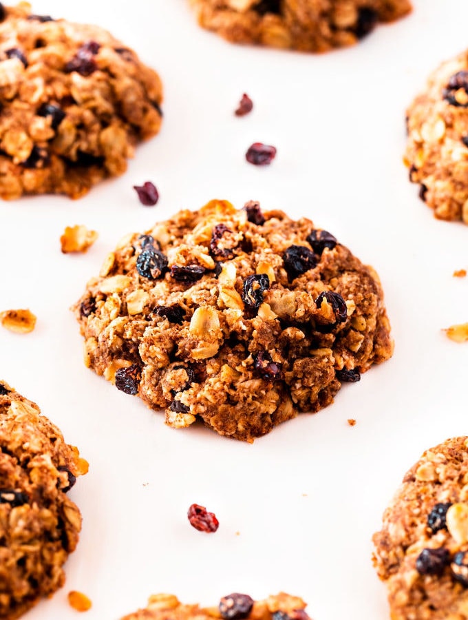 Several oatmeal raisin cookies placed on a white background.