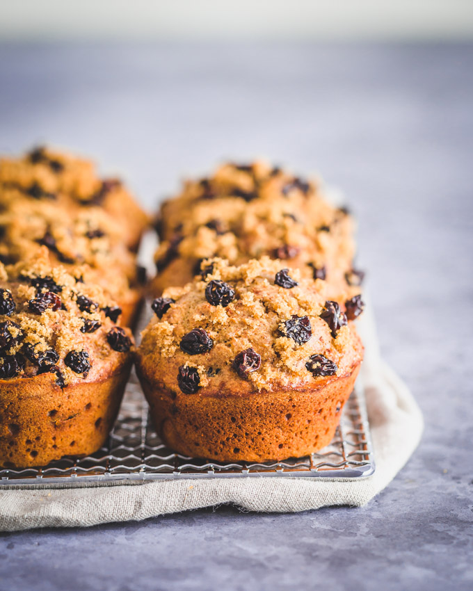 Oatmeal raisin protein muffins on a cooling rack
